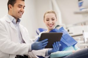 patient and dentist going over records